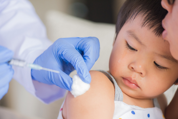 Child receiving vaccine 1025414242