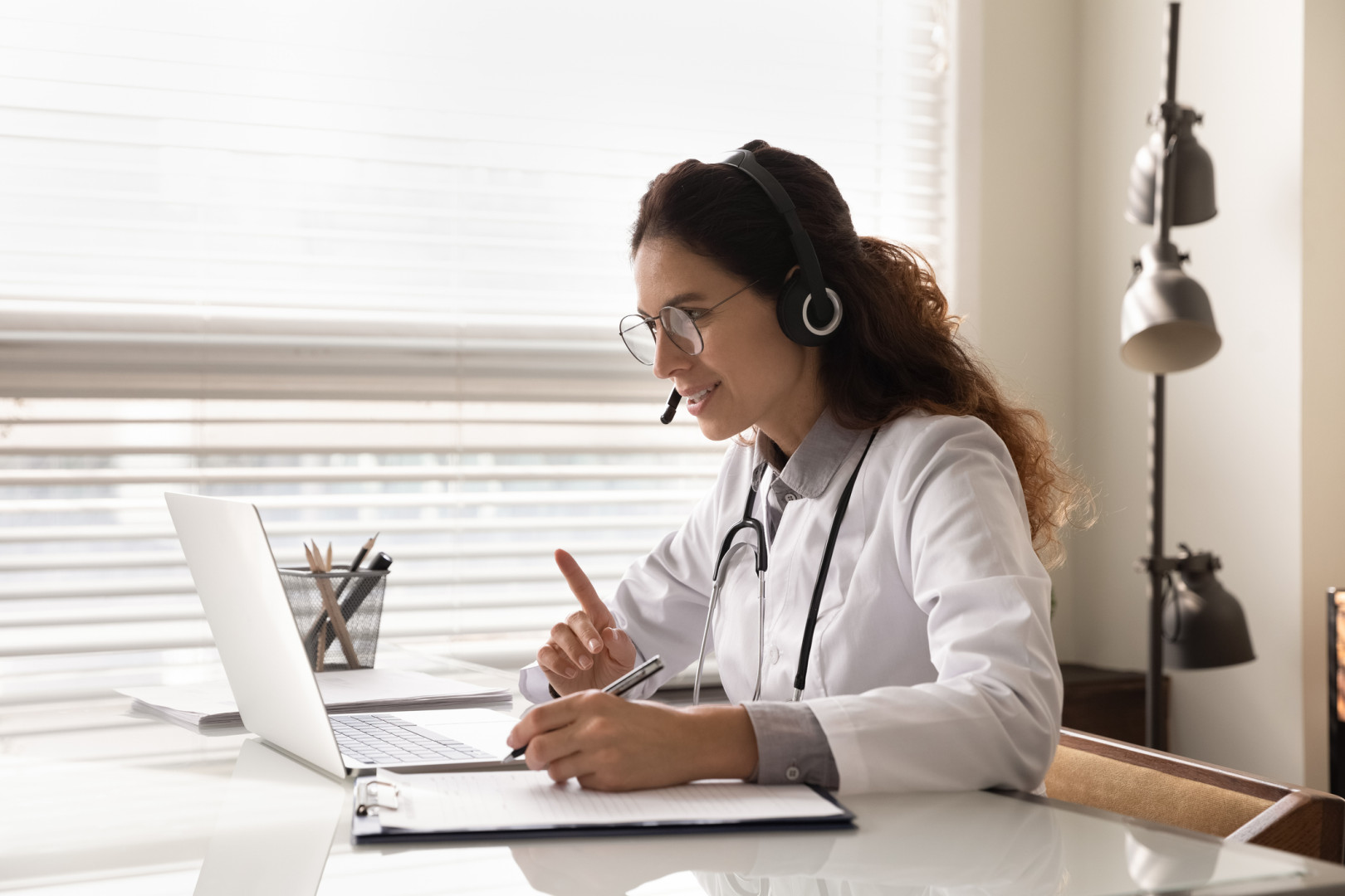 Doctor speaking with patient online.