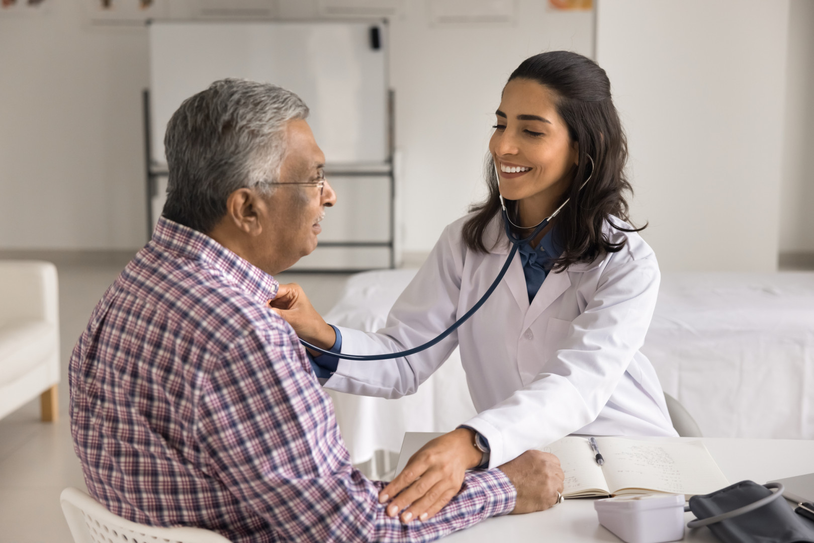 Nurse checking a patients heart rate