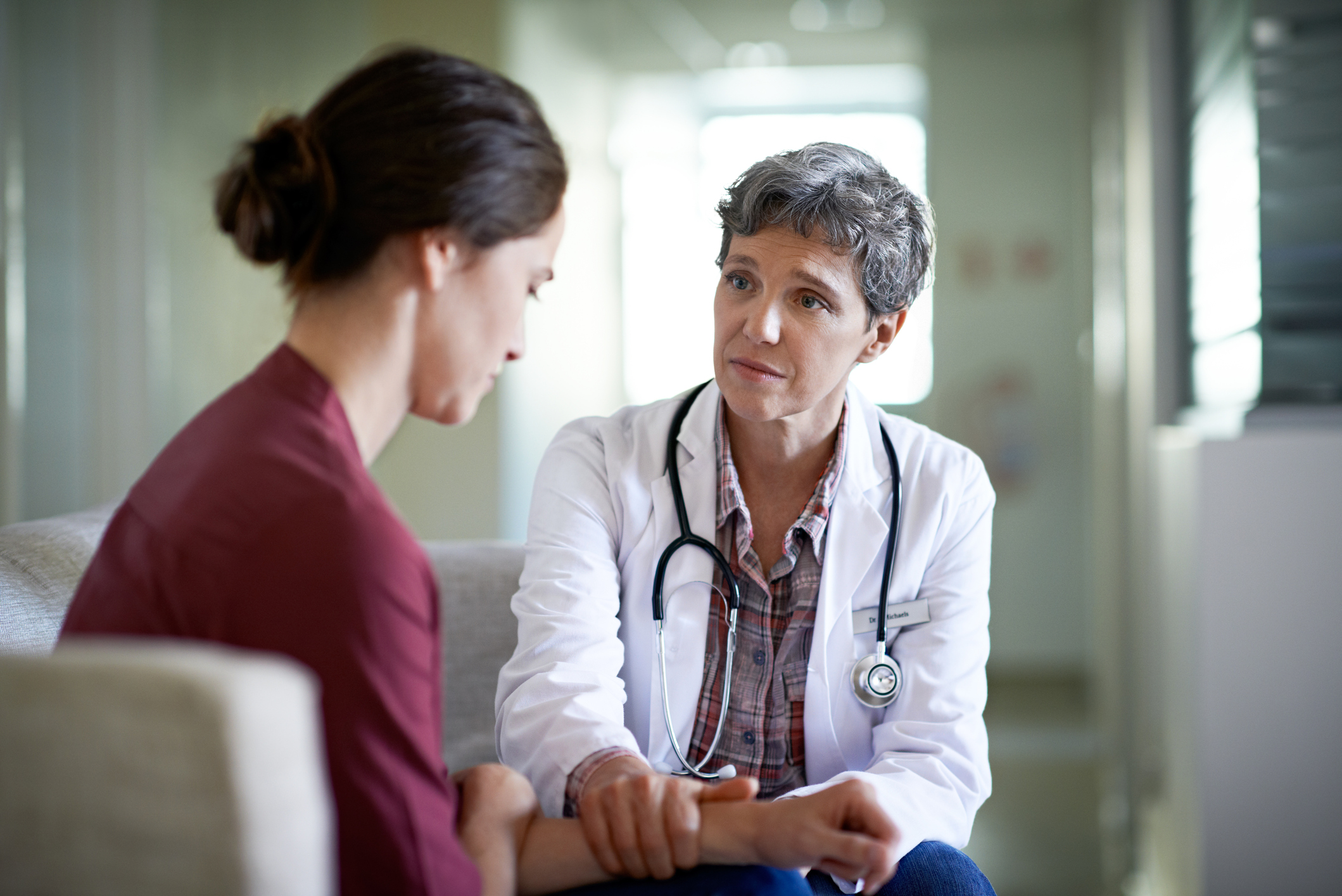 GP speaking with a female patient